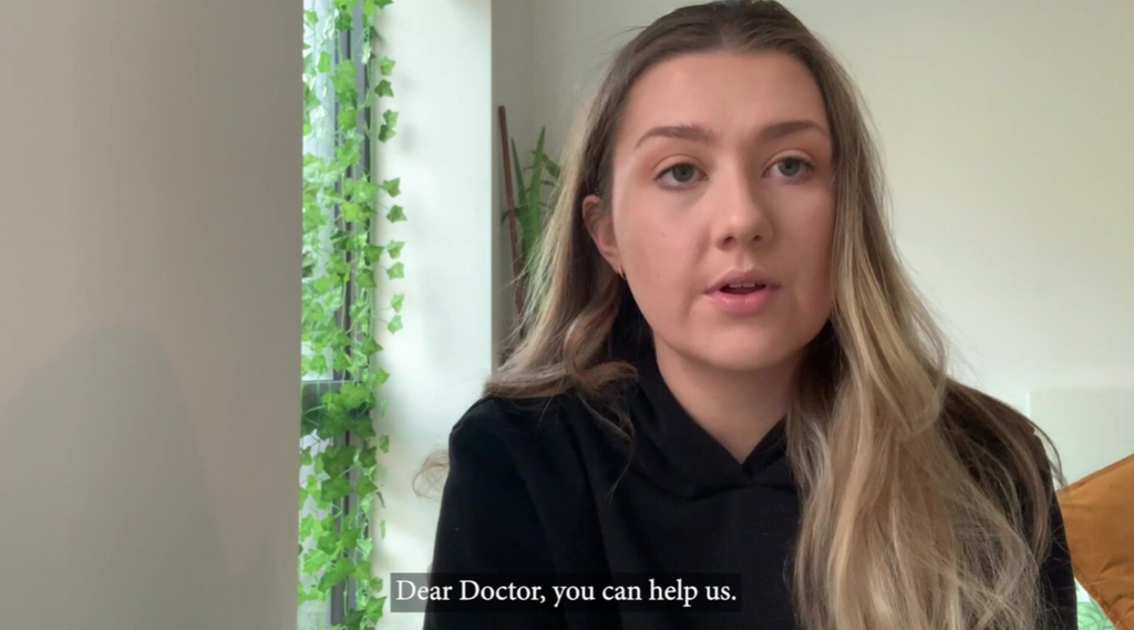 Dear Doctor screenshot of young woman wearing black top with long blond hair